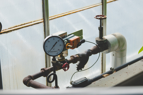 pressure gauge fixed to a piping system